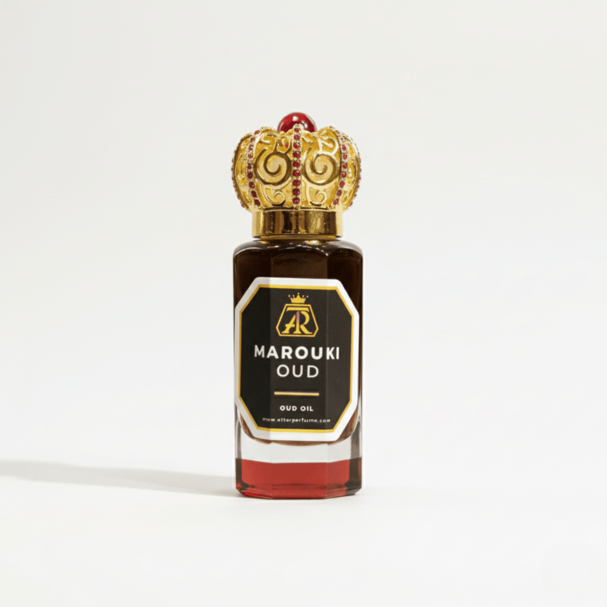 Marouki Oud oil bottle with decorative cap on a white background