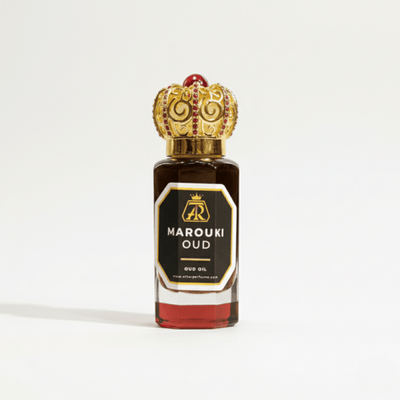 Marouki Oud oil bottle with decorative cap on a white background