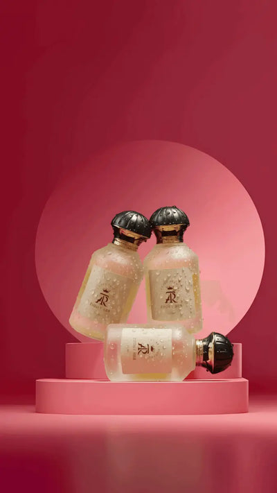 Zhory Her Eau de Parfum in a frosted bottle with a gold cap, displayed on a pink pedestal against a gradient background.