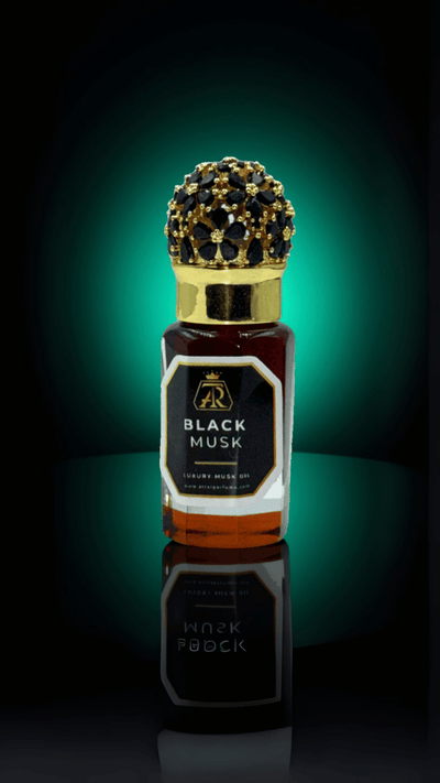Black Musk – Extrait Oil - attar perfumeBlack Musk – Extrait OilmuskAttar Perfumeattar perfumeBottle of Black Musk perfume with a gold cap on a reflective surface against a dark background6 Ml