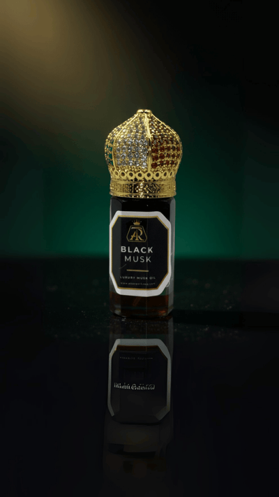 Black Musk – Extrait Oil - attar perfumeBlack Musk – Extrait OilmuskAttar Perfumeattar perfumeBottle of Black Musk perfume with a gold crown on a reflective surface3 Ml