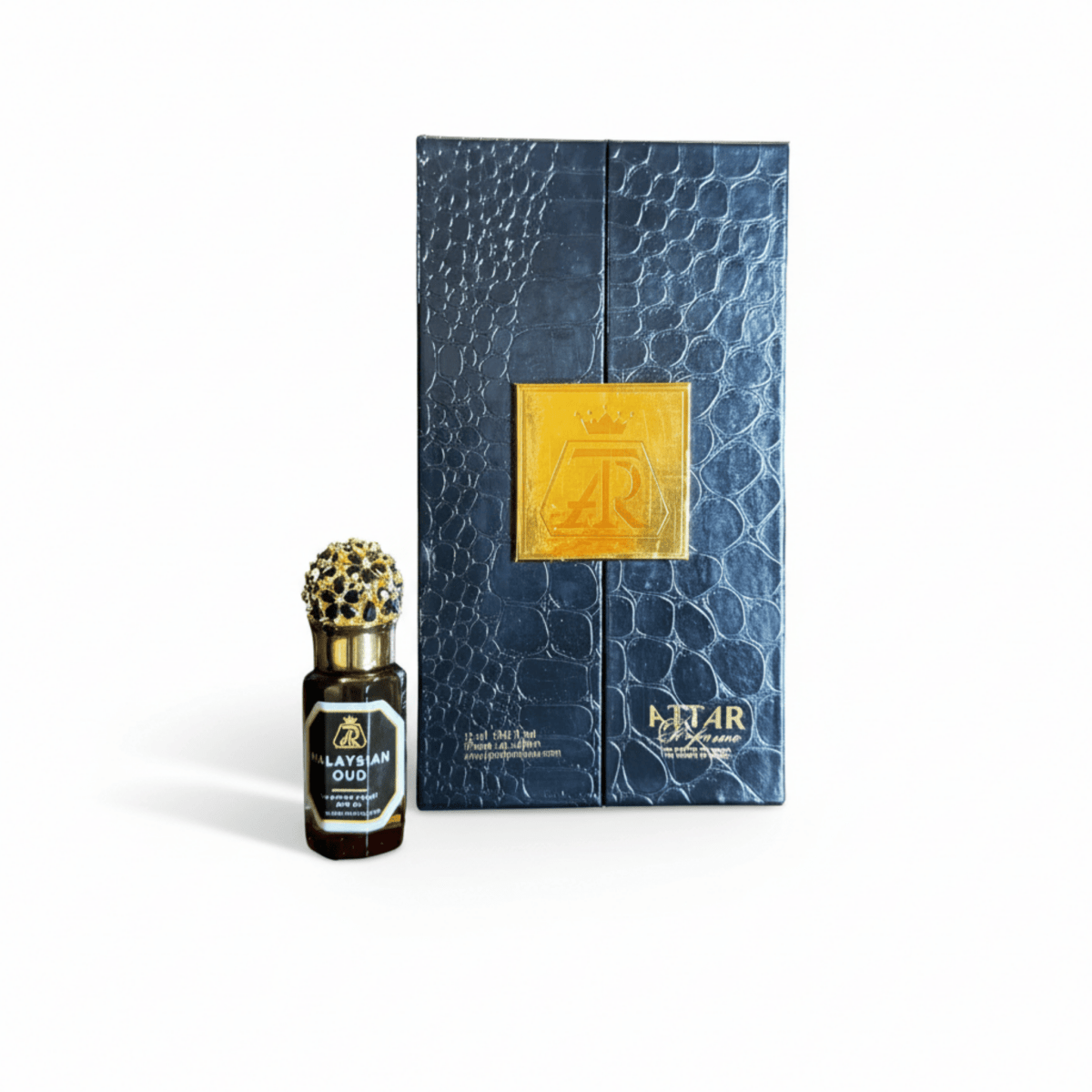 Perfume bottle with decorative cap and blue textured box on a white background